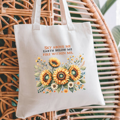 a white tote bag sitting on top of a wicker chair