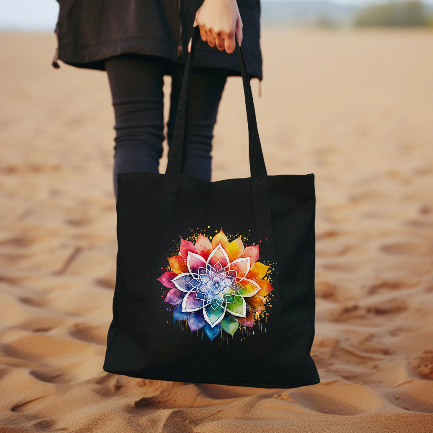 a woman holding a black bag with a flower on it