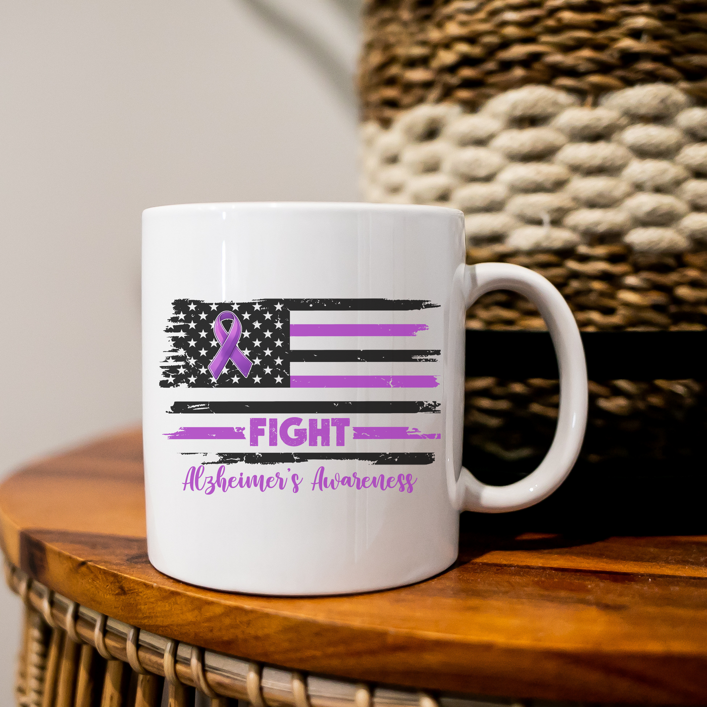 a white coffee mug with a purple ribbon on it