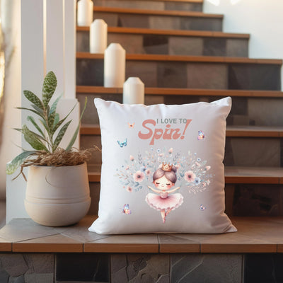 a pillow sitting on top of a table next to a potted plant