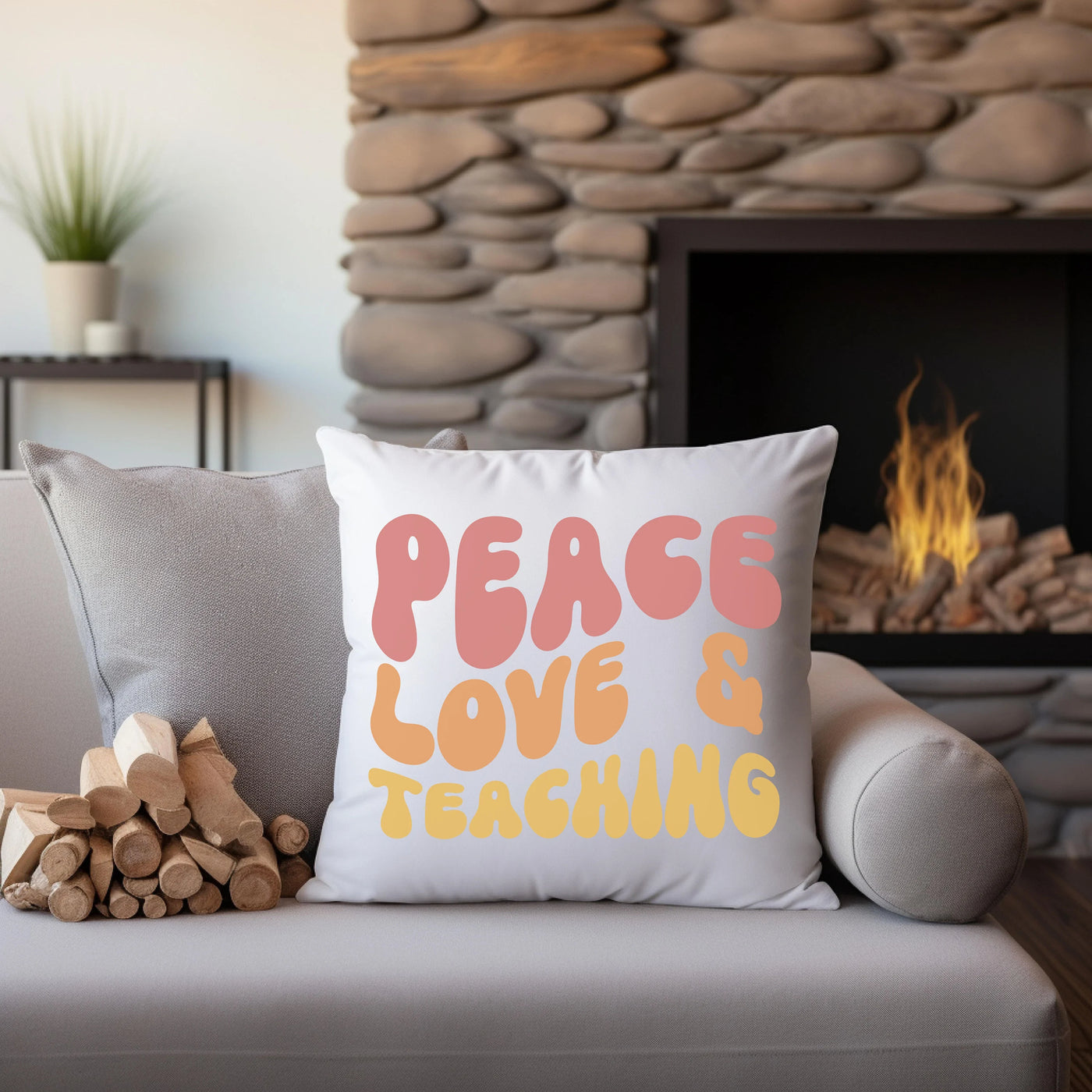 a couch with a pillow that says peace love and teaching