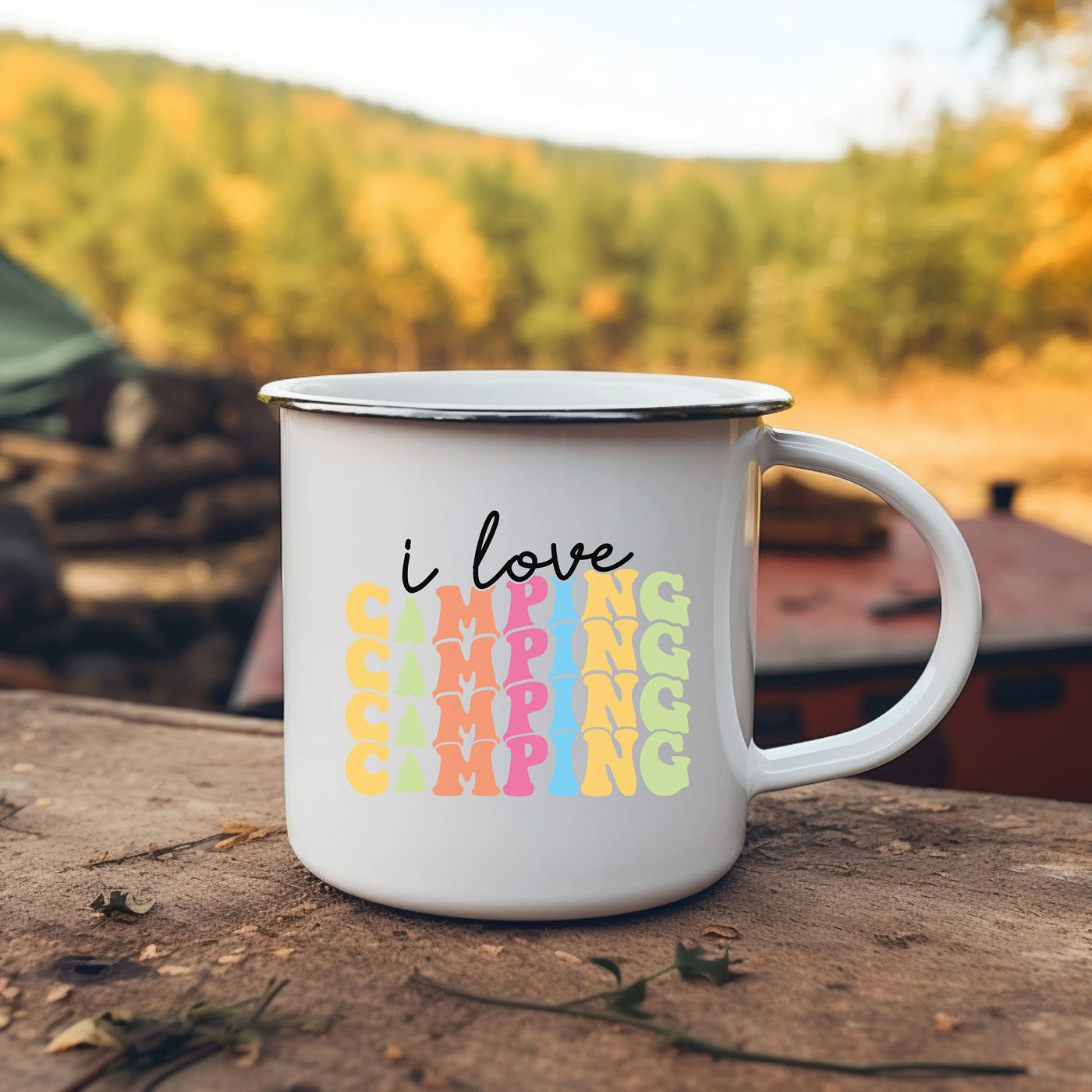 a white coffee mug with i love camping written on it