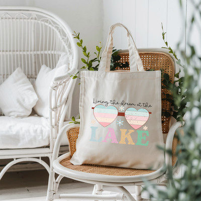 a tote bag sitting on top of a chair next to a potted plant