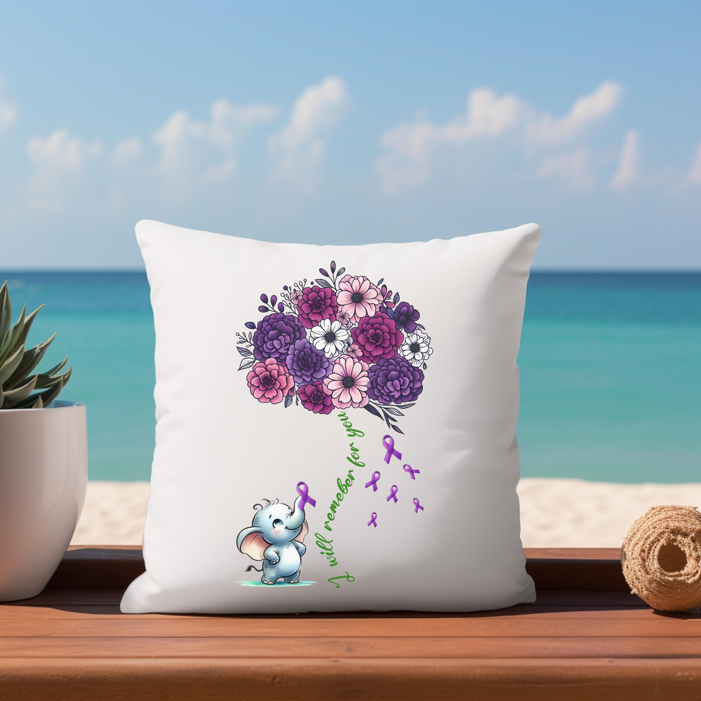 a pillow sitting on top of a table next to a potted plant