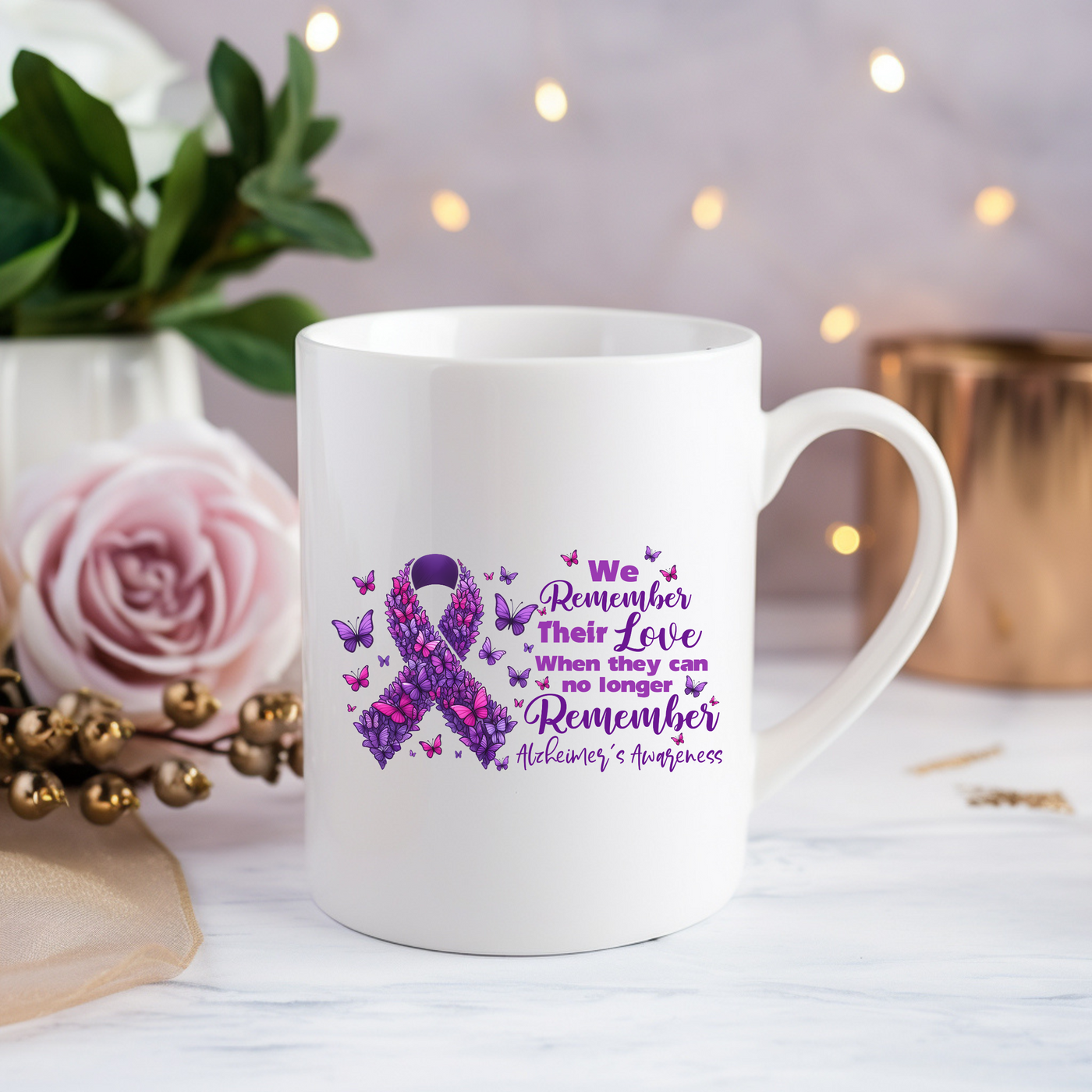 a white coffee mug with a purple ribbon on it