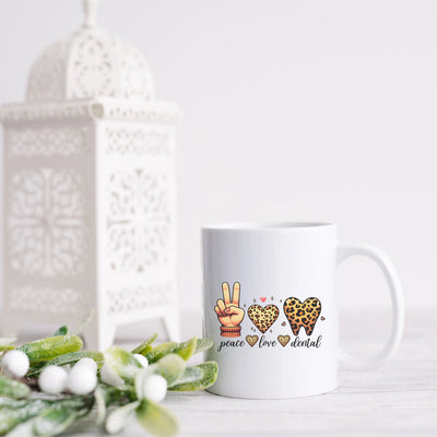 a white coffee mug sitting on top of a table