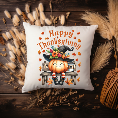 a white pillow with a happy thanksgiving pumpkin on it